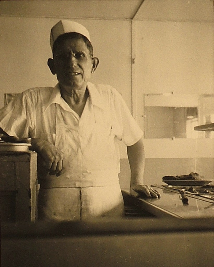 Frank Demeris cooking in the kitchen of the Demeris restaurant in the early days.